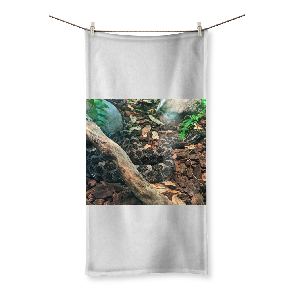 A vibrant Snake Sublimation All Over Towel showcasing colorful designs on one side and soft cotton texture on the other, perfect for beach or bath use.