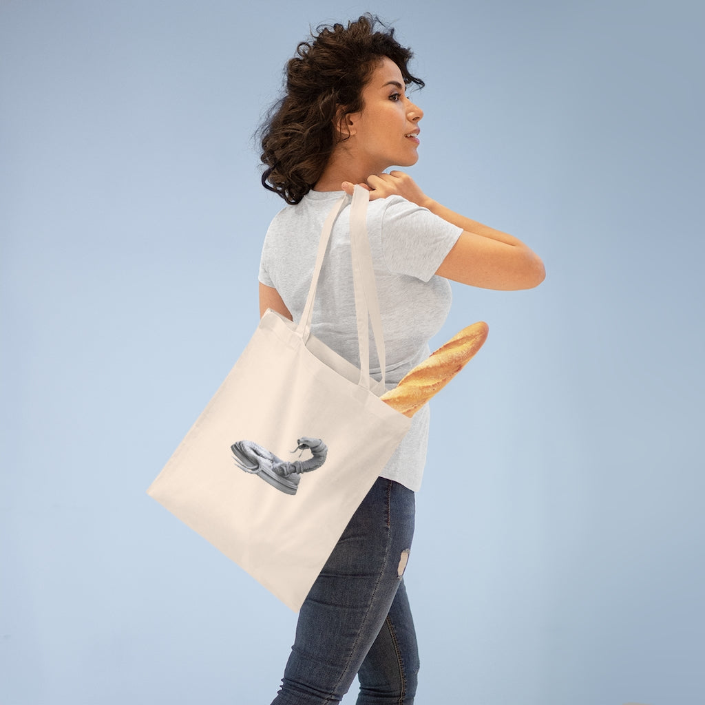 A stylish Snake Tote Bag made of 100% cotton with long handles and cross-stitched detailing, available in multiple colors.