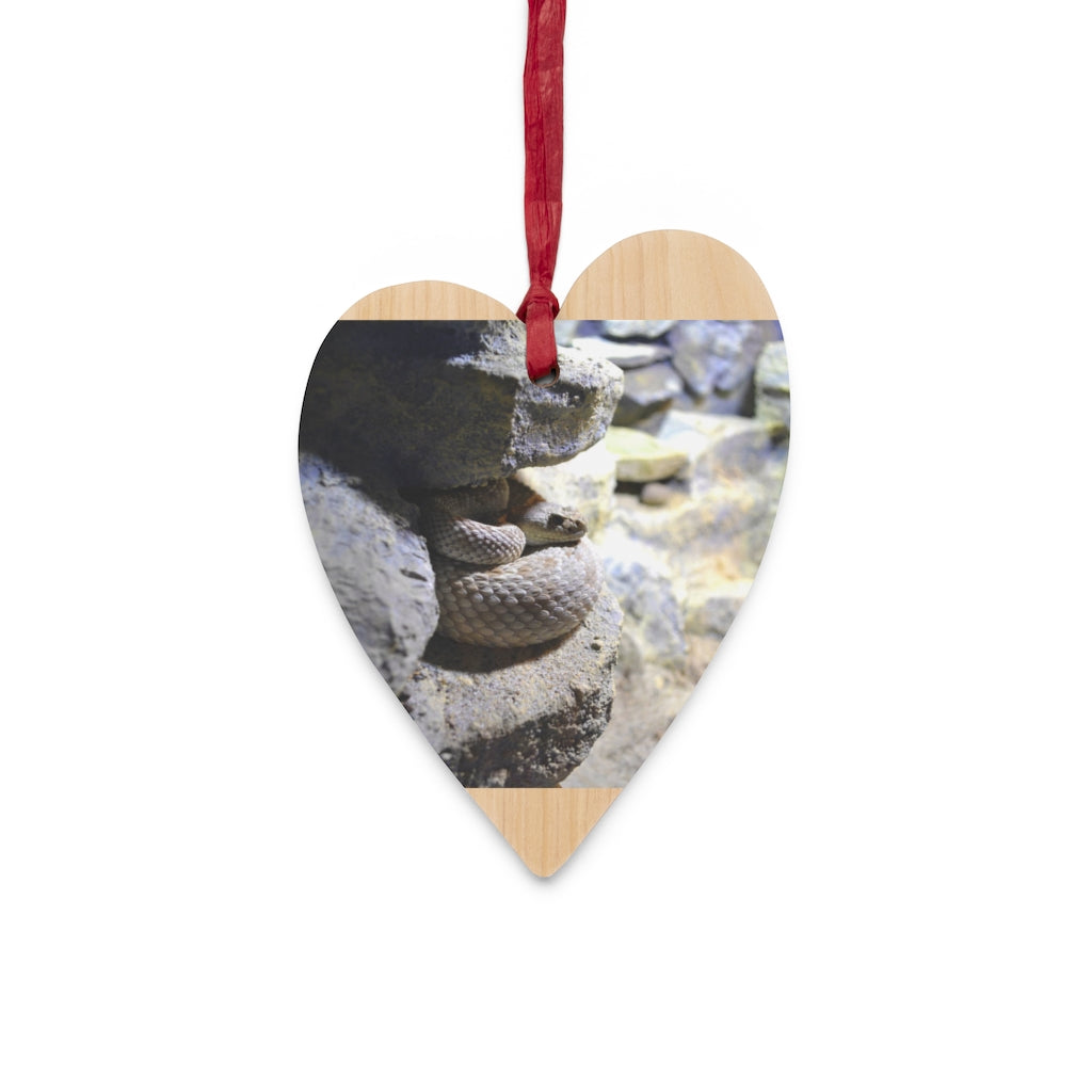 A collection of Snake Wooden Christmas Ornaments in various whimsical shapes, featuring a rustic wooden finish and red ribbons for hanging.