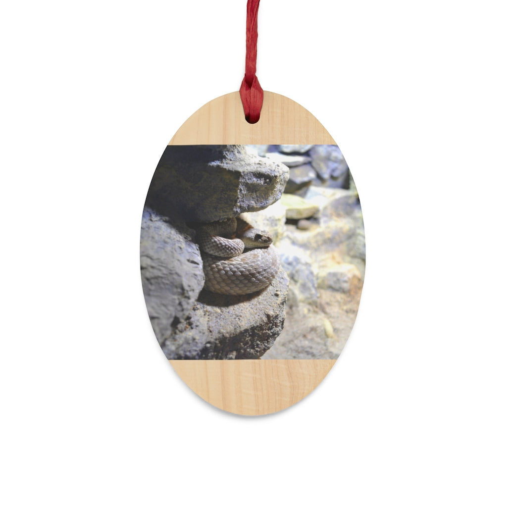 A collection of Snake Wooden Christmas Ornaments in various whimsical shapes, featuring a rustic wooden finish and red ribbons for hanging.
