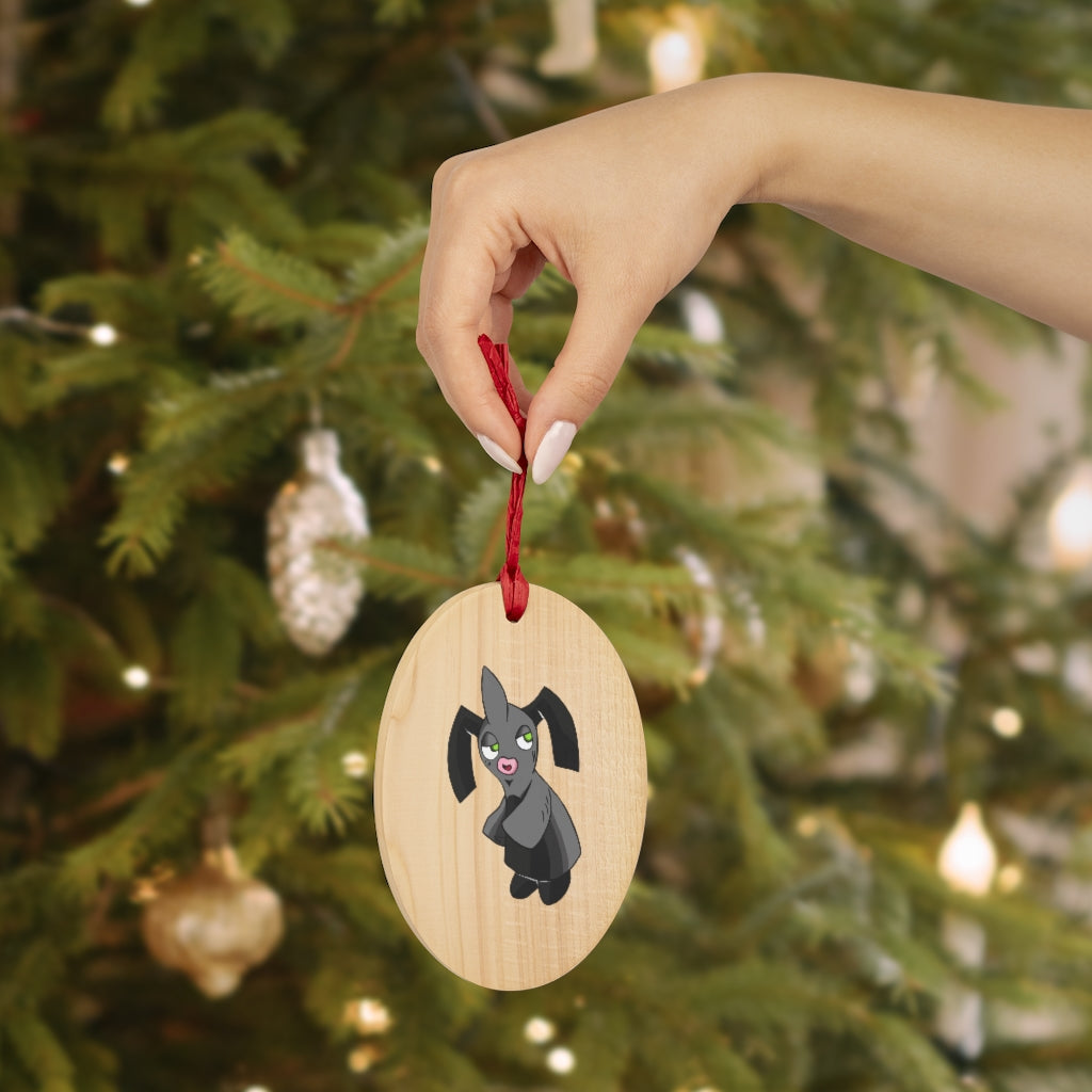 A collection of Snaughtnaut Wooden Christmas Ornaments in various whimsical shapes, featuring a rustic wooden finish and red ribbons for hanging.