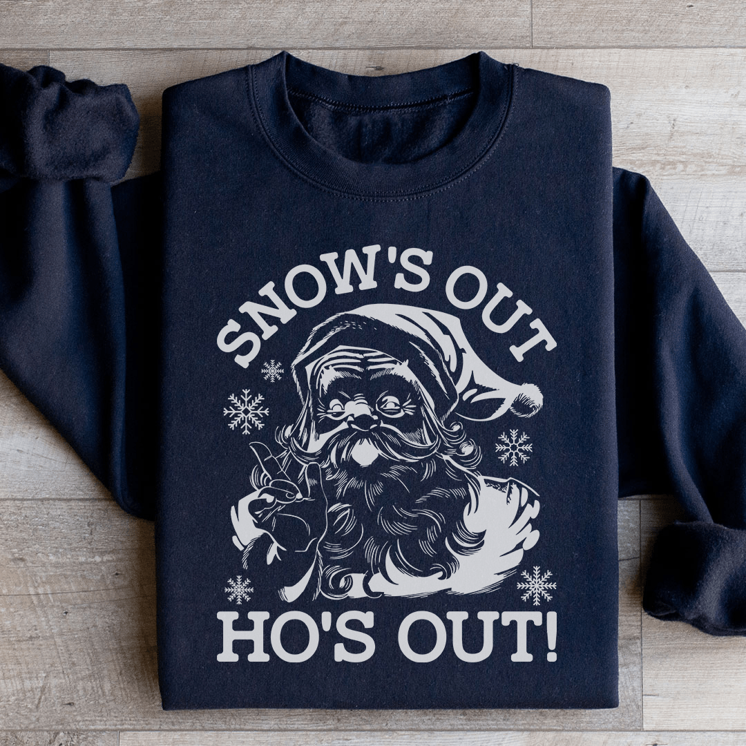 A festive Snow's Out Ho's Out Sweatshirt featuring a vibrant holiday design, made from 100% soft cotton, perfect for Christmas celebrations.