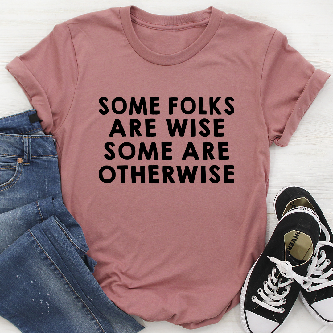 A comfortable and stylish t-shirt featuring the quote 'Some Folks Are Wise Some Are Otherwise', made from soft ring-spun cotton.