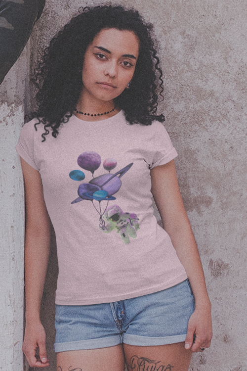 A stylish unisex t-shirt featuring a space astronaut holding colorful planet balloons, made from soft ring-spun cotton.
