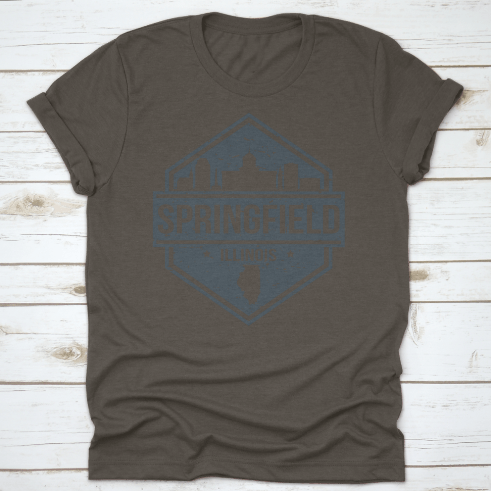 A stylish t-shirt featuring the Springfield Illinois skyline design, showcasing iconic landmarks in a travel stamp style.