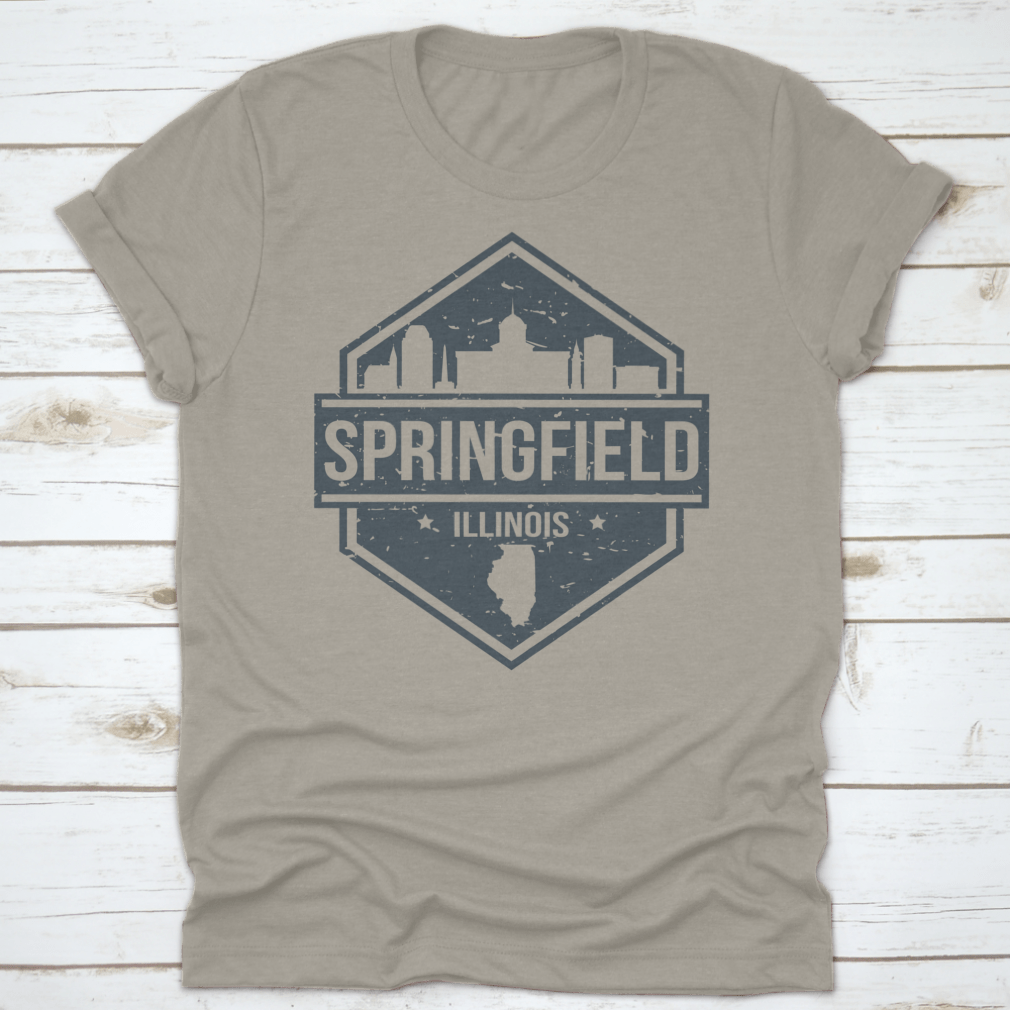 A stylish t-shirt featuring the Springfield Illinois skyline design, showcasing iconic landmarks in a travel stamp style.