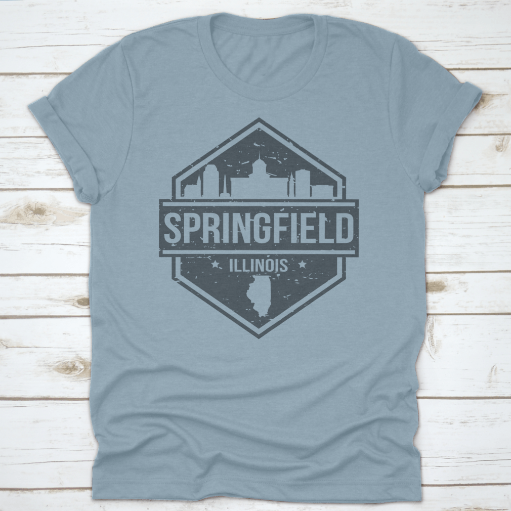 A stylish t-shirt featuring the Springfield Illinois skyline design, showcasing iconic landmarks in a travel stamp style.