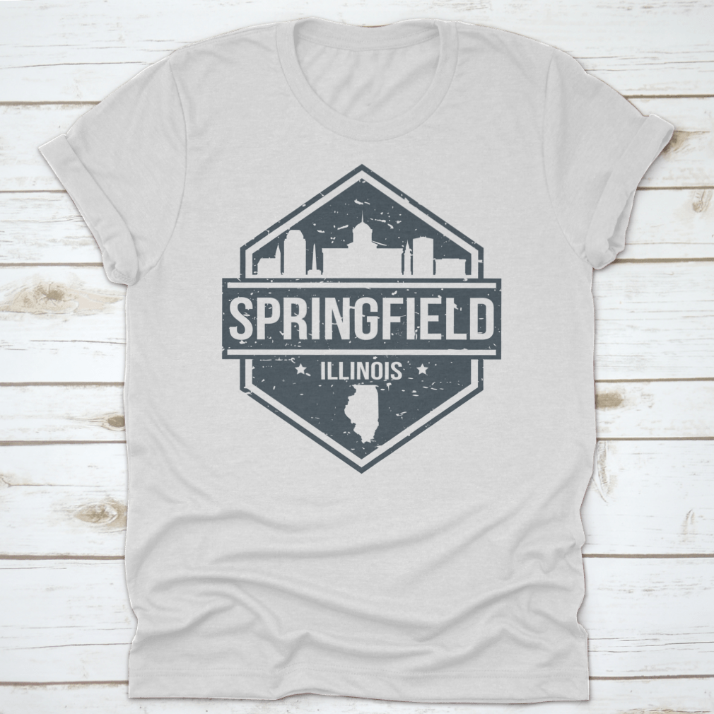 A stylish t-shirt featuring the Springfield Illinois skyline design, showcasing iconic landmarks in a travel stamp style.