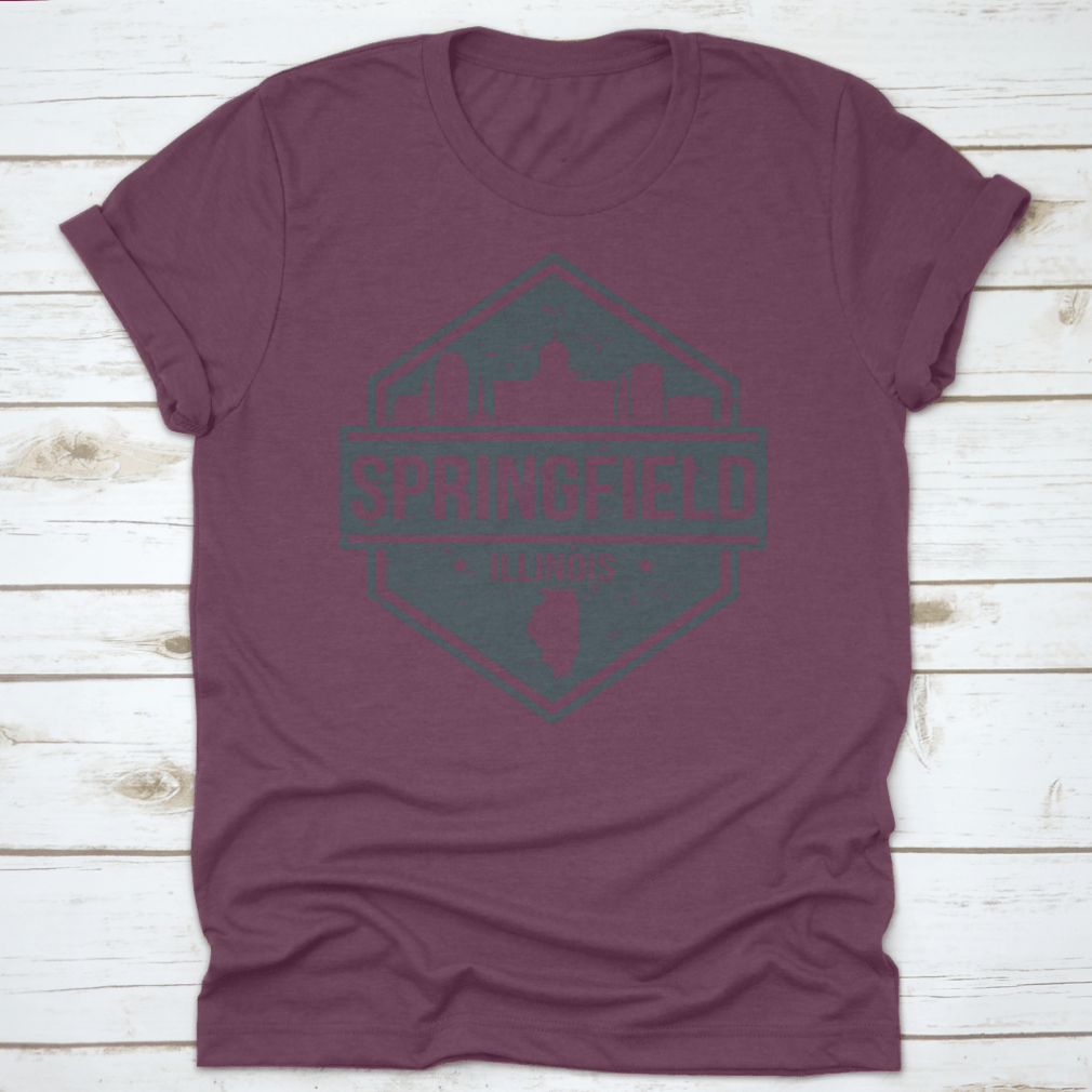 A stylish t-shirt featuring the Springfield Illinois skyline design, showcasing iconic landmarks in a travel stamp style.