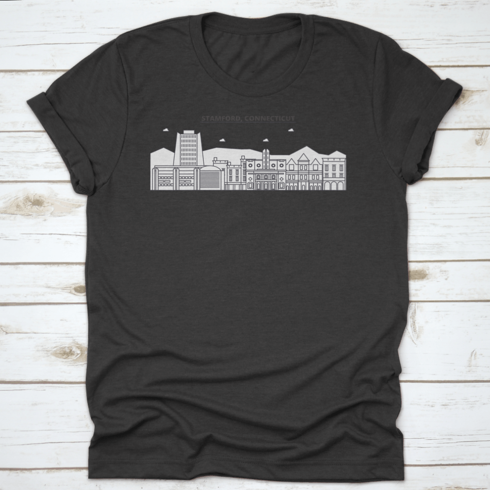 A stylish cotton t-shirt featuring a linear illustration of the Stamford, Connecticut skyline, showcasing iconic buildings and structures.