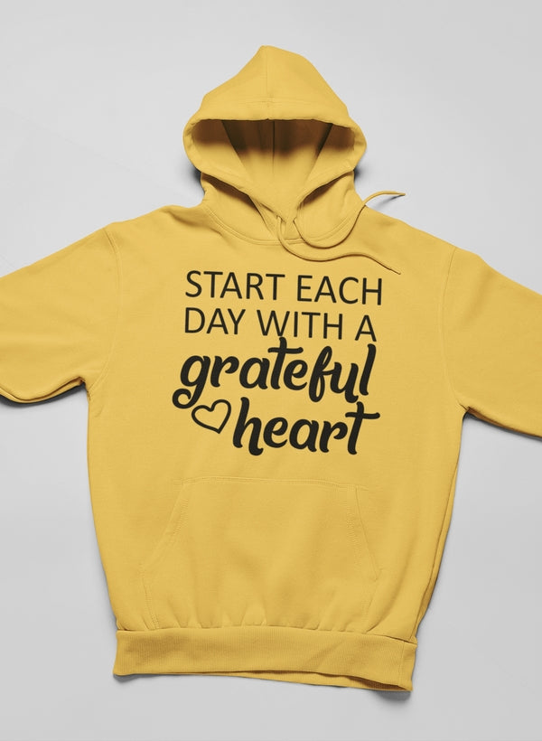 Cozy hoodie featuring the phrase 'Start Each Day With A Grateful Heart', made from cotton/poly fleece blend, showcasing adjustable hood and banded cuffs.