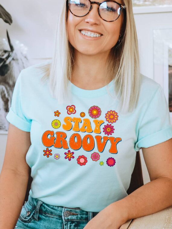 Stay Groovy T-shirt made of premium ring spun cotton with a vibrant flex print design, available in various sizes.
