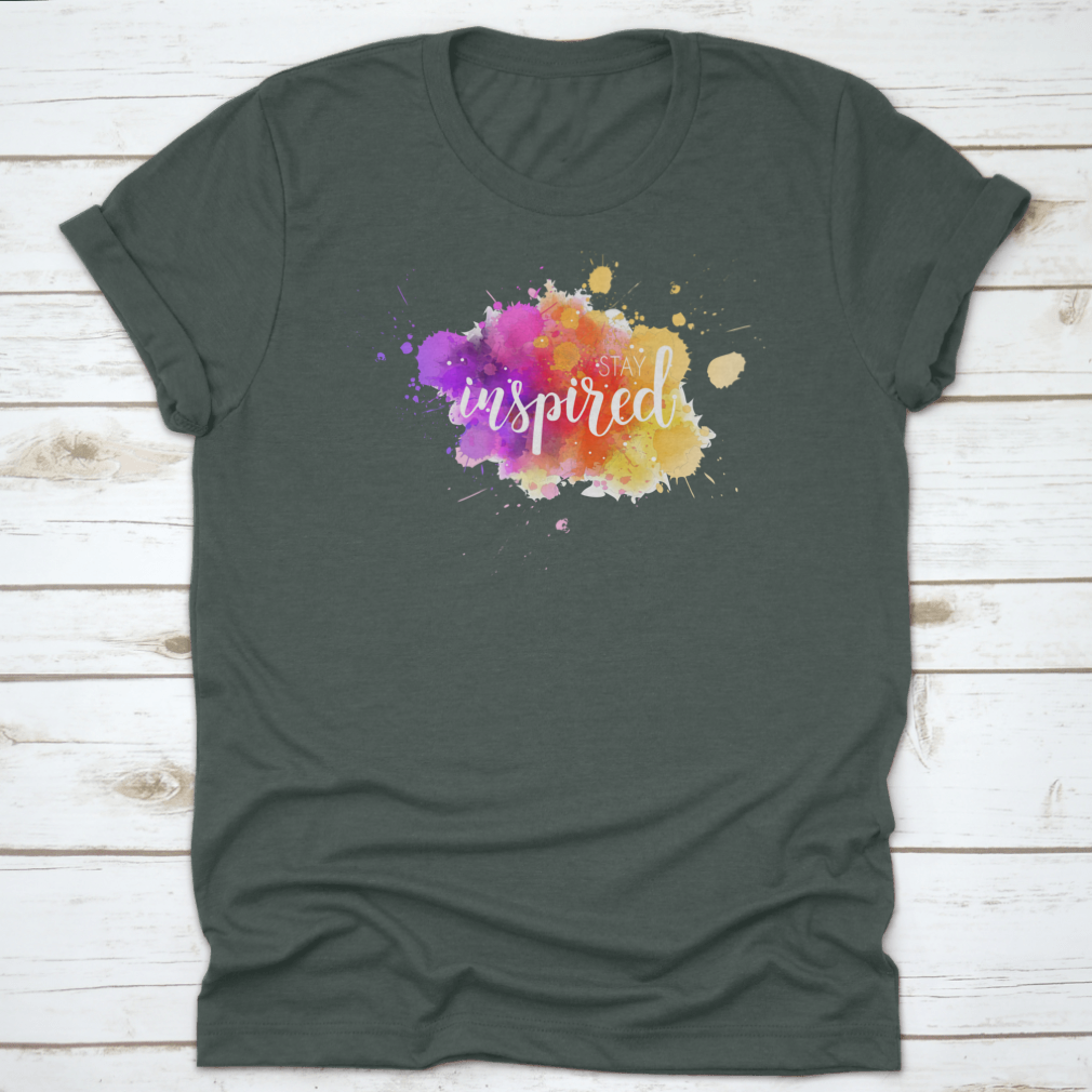 A stylish t-shirt featuring a hand lettering phrase on a vibrant watercolor background, made from 100% cotton for comfort.
