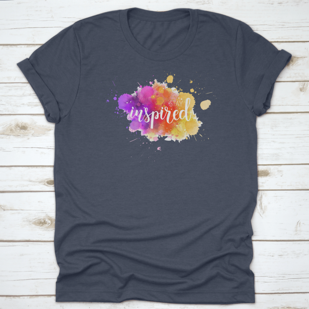 A stylish t-shirt featuring a hand lettering phrase on a vibrant watercolor background, made from 100% cotton for comfort.