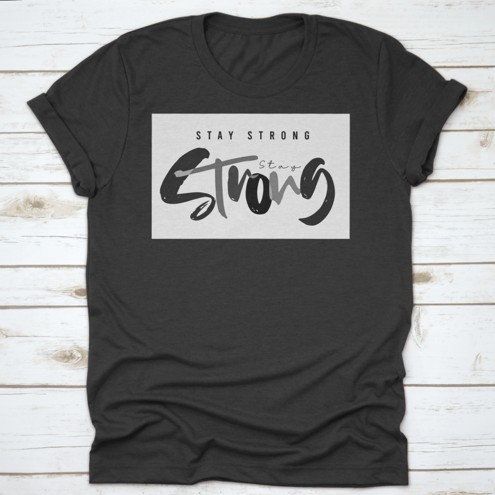 Stay Strong Typography Design T-Shirt in various colors, showcasing its comfortable fabric and classic fit.