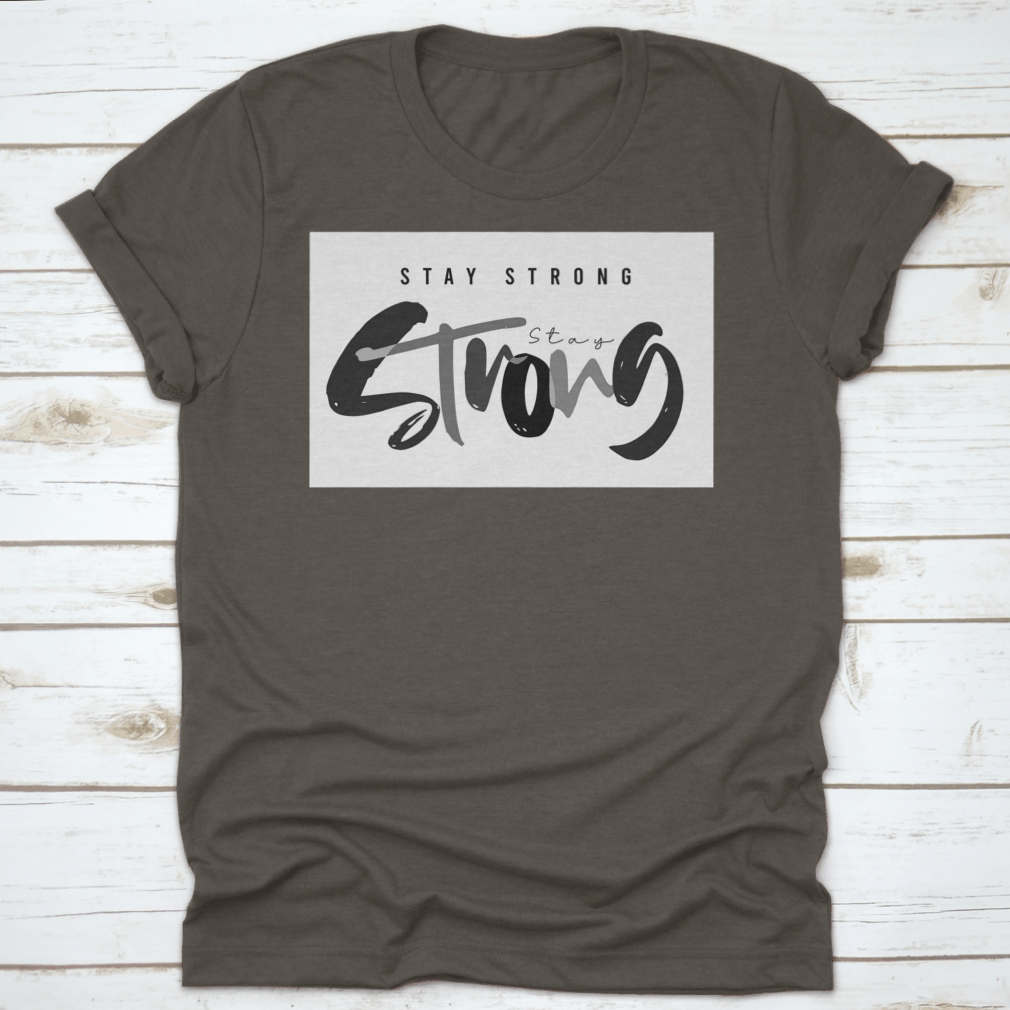 Stay Strong Typography Design T-Shirt in various colors, showcasing its comfortable fabric and classic fit.