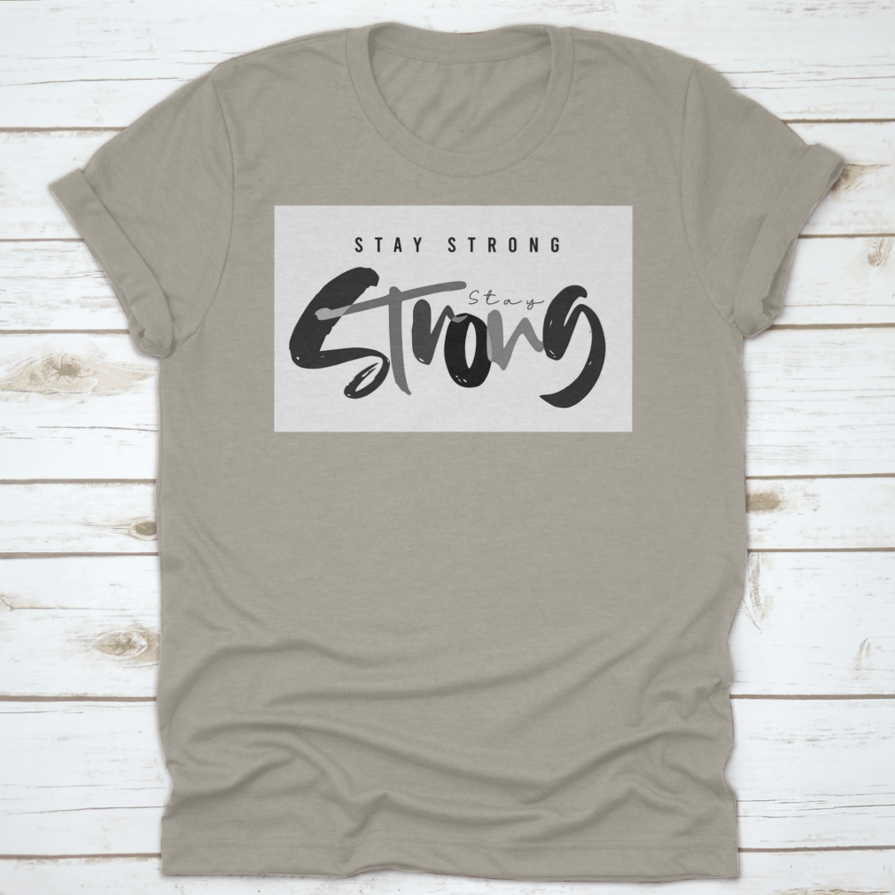 Stay Strong Typography Design T-Shirt in various colors, showcasing its comfortable fabric and classic fit.