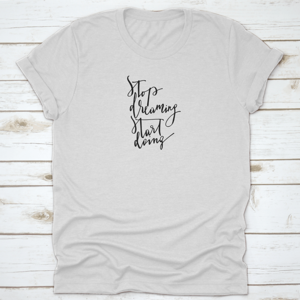 A stylish 'Stop Dreaming Start Doing' T-Shirt made from 100% cotton, featuring a classic fit and motivational design.