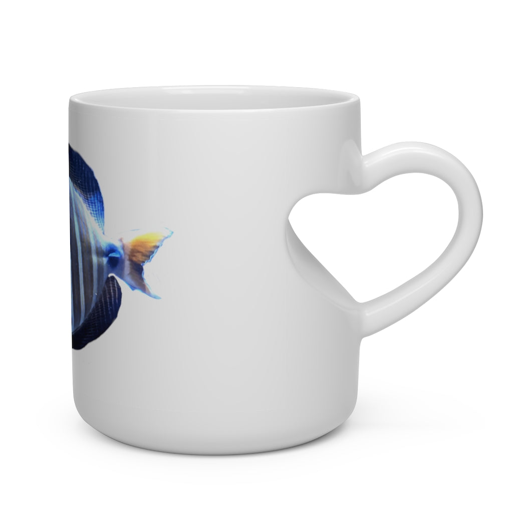 A white ceramic heart-shaped mug with a striped fish design and a heart-shaped handle, perfect for hot beverages.