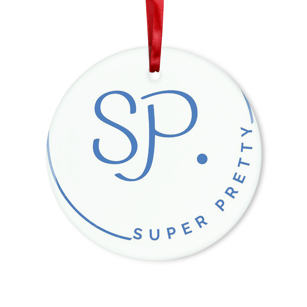 A beautifully crafted glass hanging ornament in round and heart shapes, featuring a red ribbon and gold string for hanging, elegantly packaged in a white box.