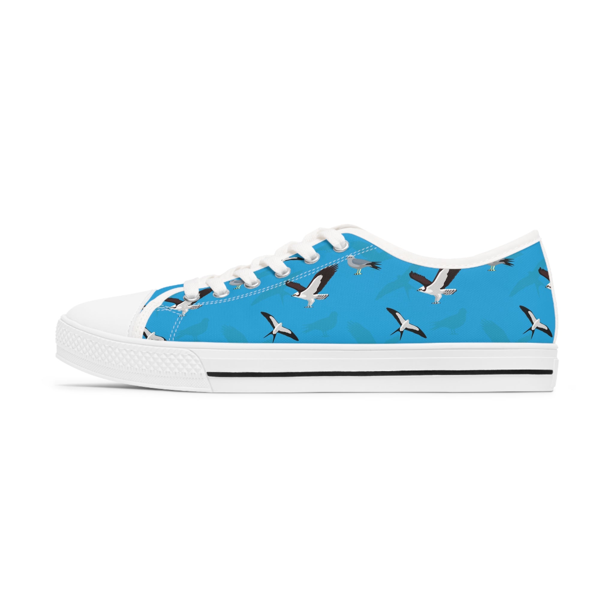 A pair of Swallow-tailed Kite Women's Low Top Sneakers in black and white, featuring breathable canvas, memory foam insoles, and stylish silver metal eyelets.