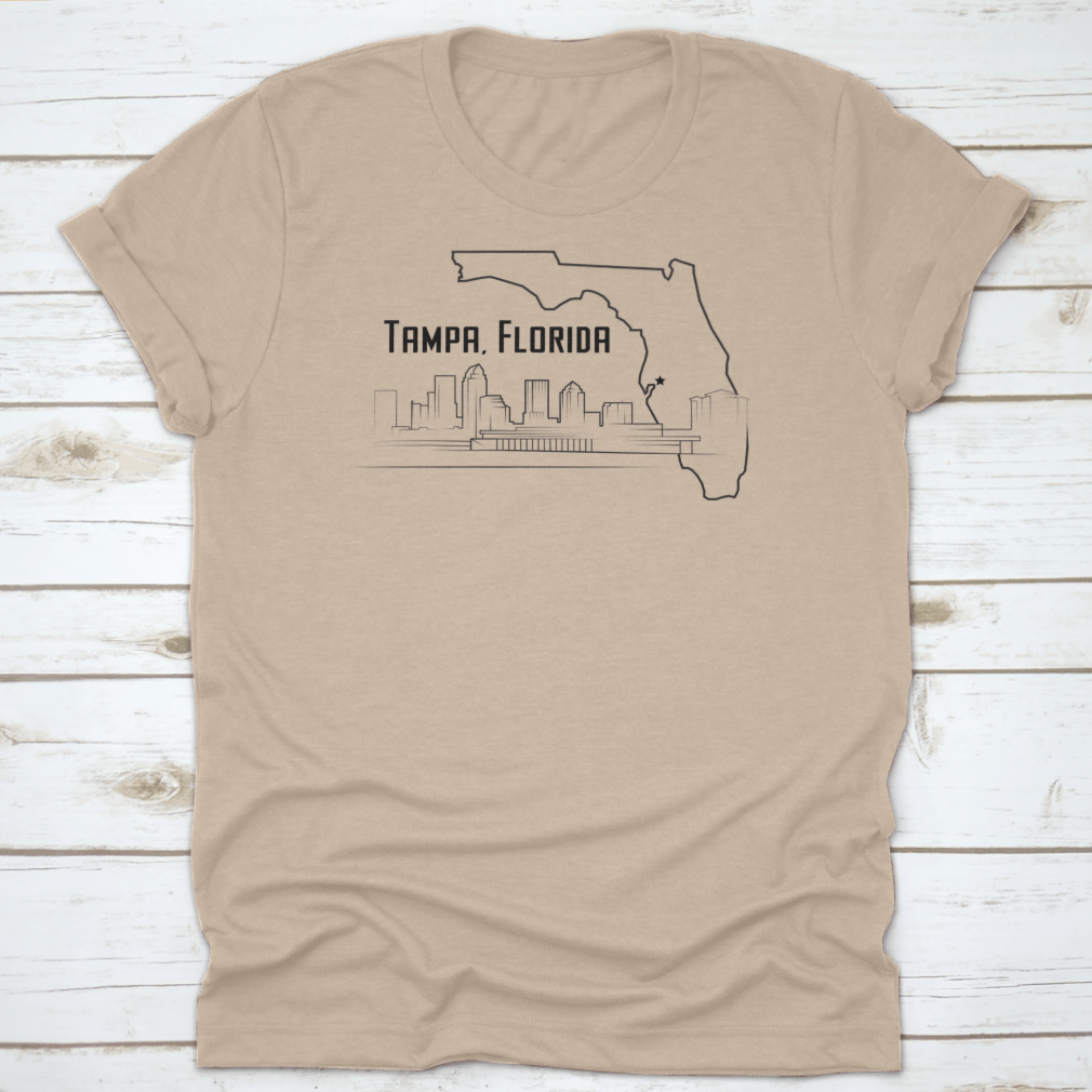 A stylish t-shirt featuring a sketch drawing of Tampa, Florida's city map and landmarks, showcasing its unique design.