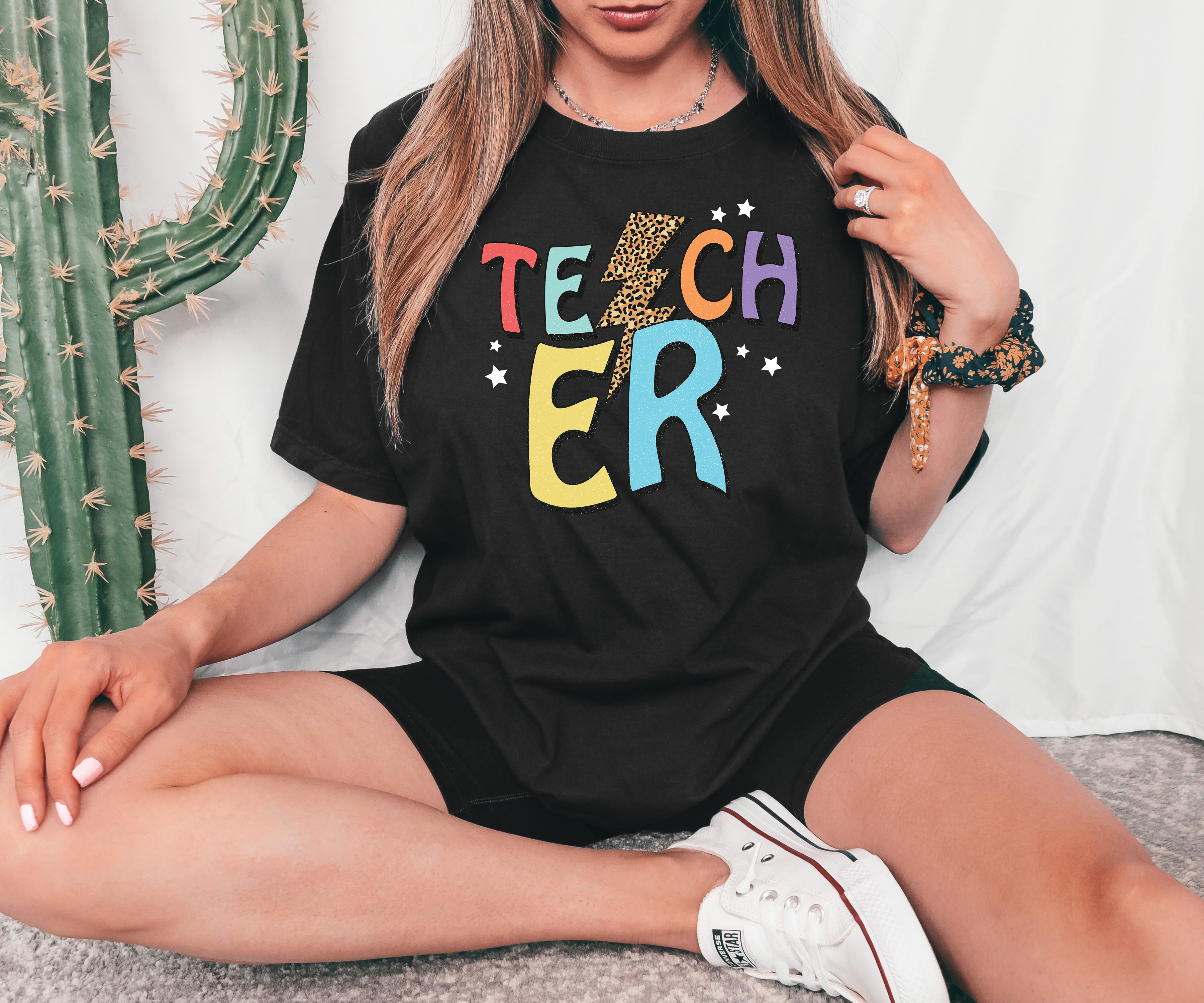 A stylish Teacher T-shirt made from premium ring spun cotton, featuring a vibrant flex print design, available in various sizes.
