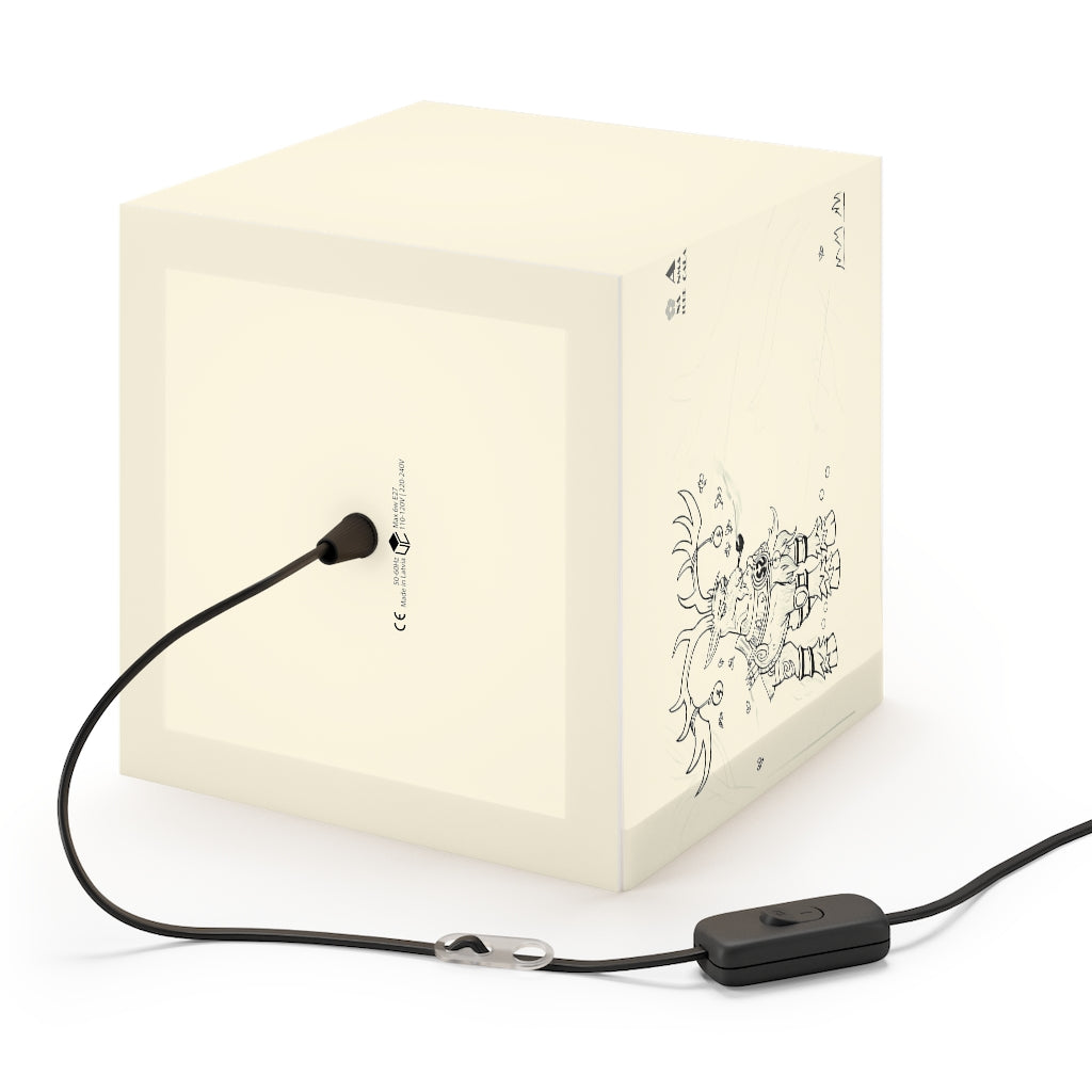 A beautifully designed cube lamp with intricate patterns, showcasing its unique light display in a cozy indoor setting.