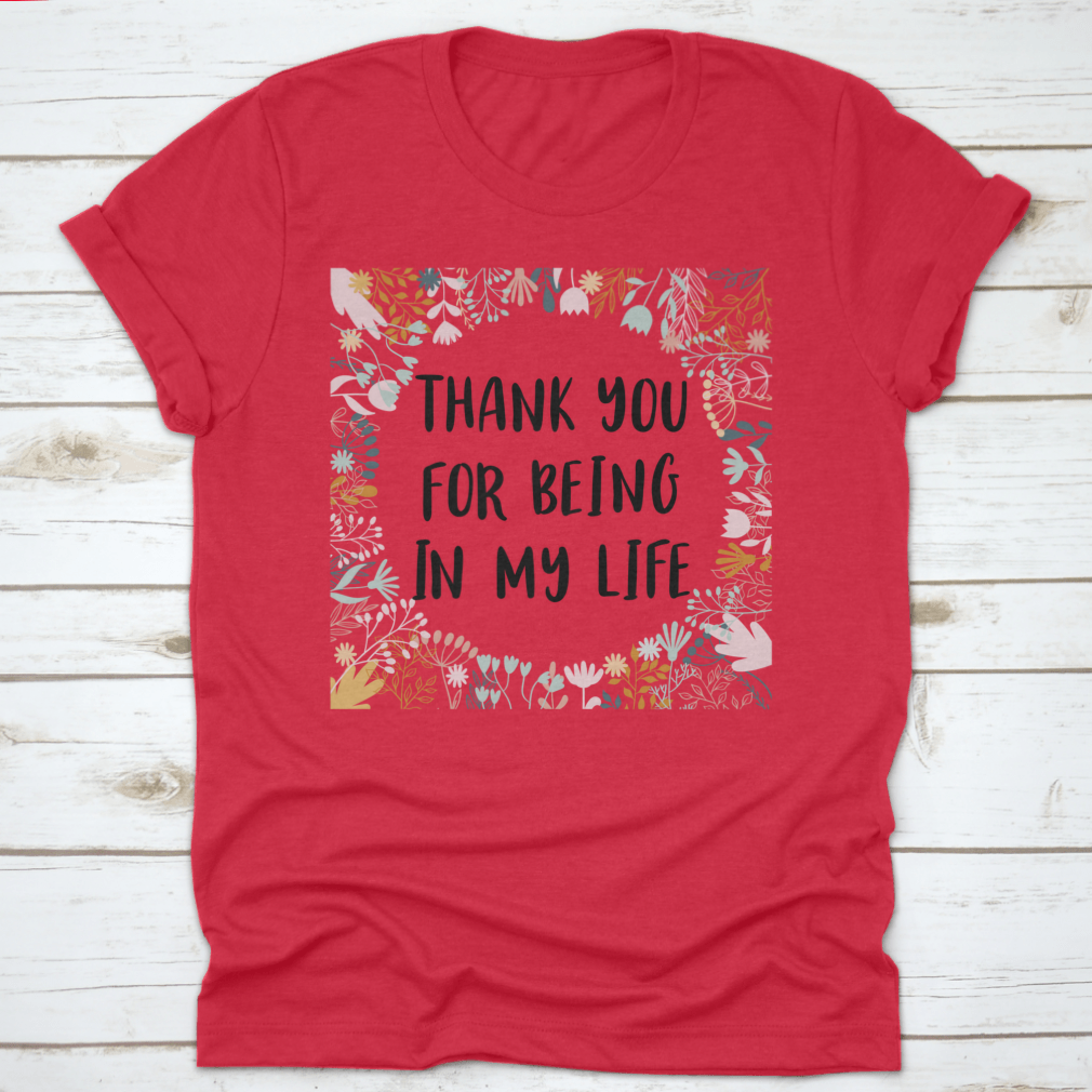 Red shirt with gratitude message.