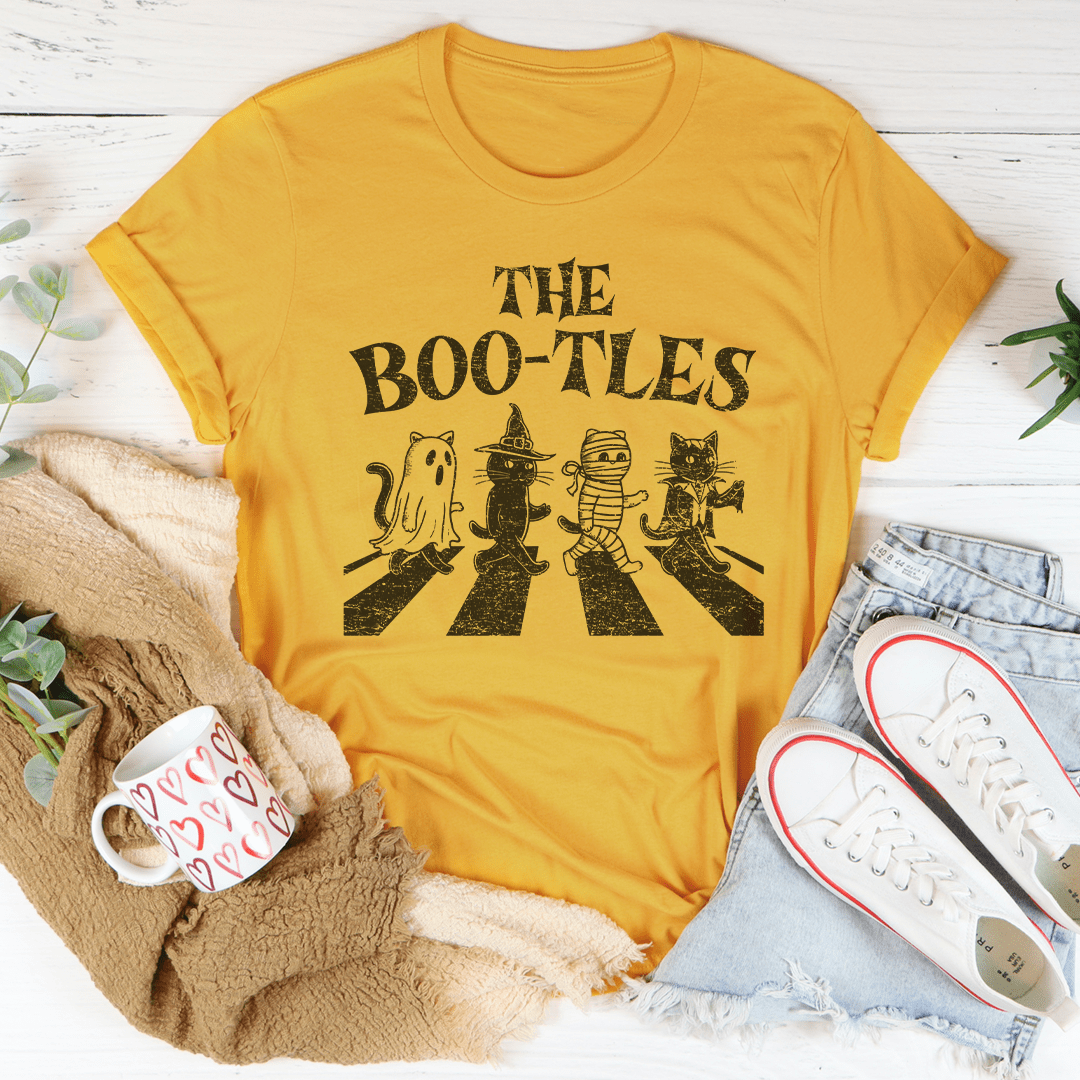 The Boo-tless Cat Tee, a unisex short sleeve t-shirt made from soft cotton, featuring a vibrant cat design, perfect for casual wear.