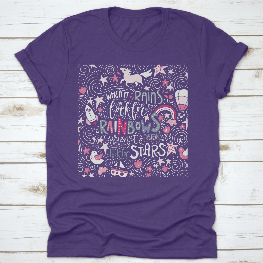 A comfortable t-shirt featuring the inspirational quote 'When It Rains Look For Rainbows' in a stylish hand-drawn vector design.