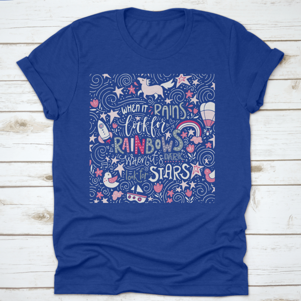 A comfortable t-shirt featuring the inspirational quote 'When It Rains Look For Rainbows' in a stylish hand-drawn vector design.