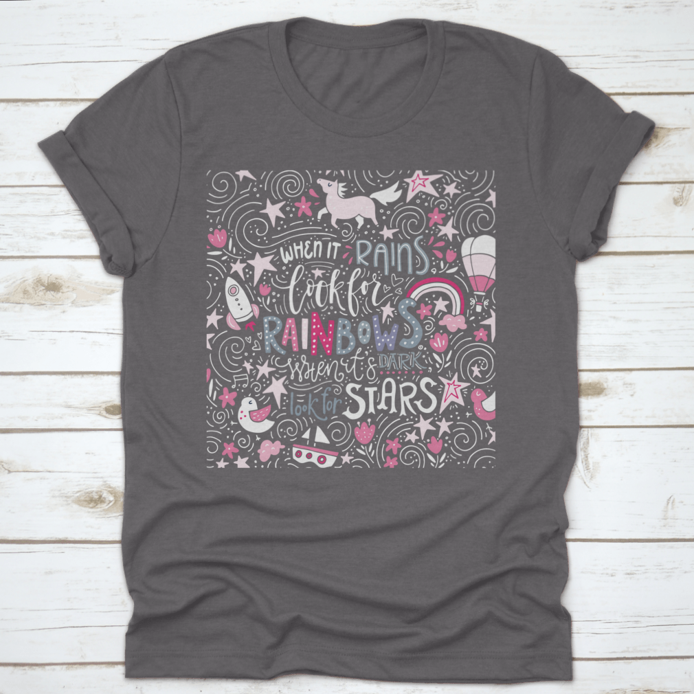 A comfortable t-shirt featuring the inspirational quote 'When It Rains Look For Rainbows' in a stylish hand-drawn vector design.