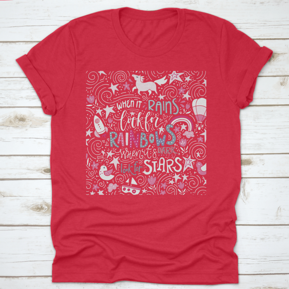 A comfortable t-shirt featuring the inspirational quote 'When It Rains Look For Rainbows' in a stylish hand-drawn vector design.