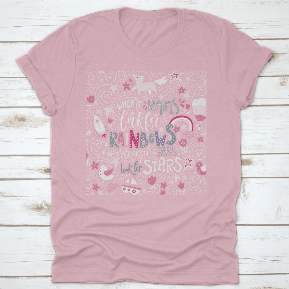A comfortable t-shirt featuring the inspirational quote 'When It Rains Look For Rainbows' in a stylish hand-drawn vector design.