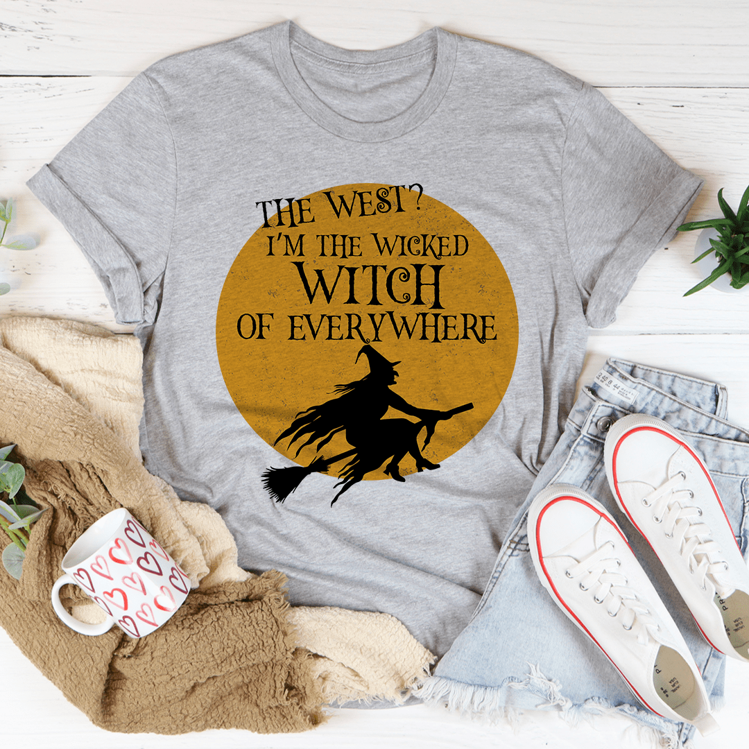 A black Halloween tee featuring a whimsical witch design, made from 100% soft cotton, perfect for festive celebrations.