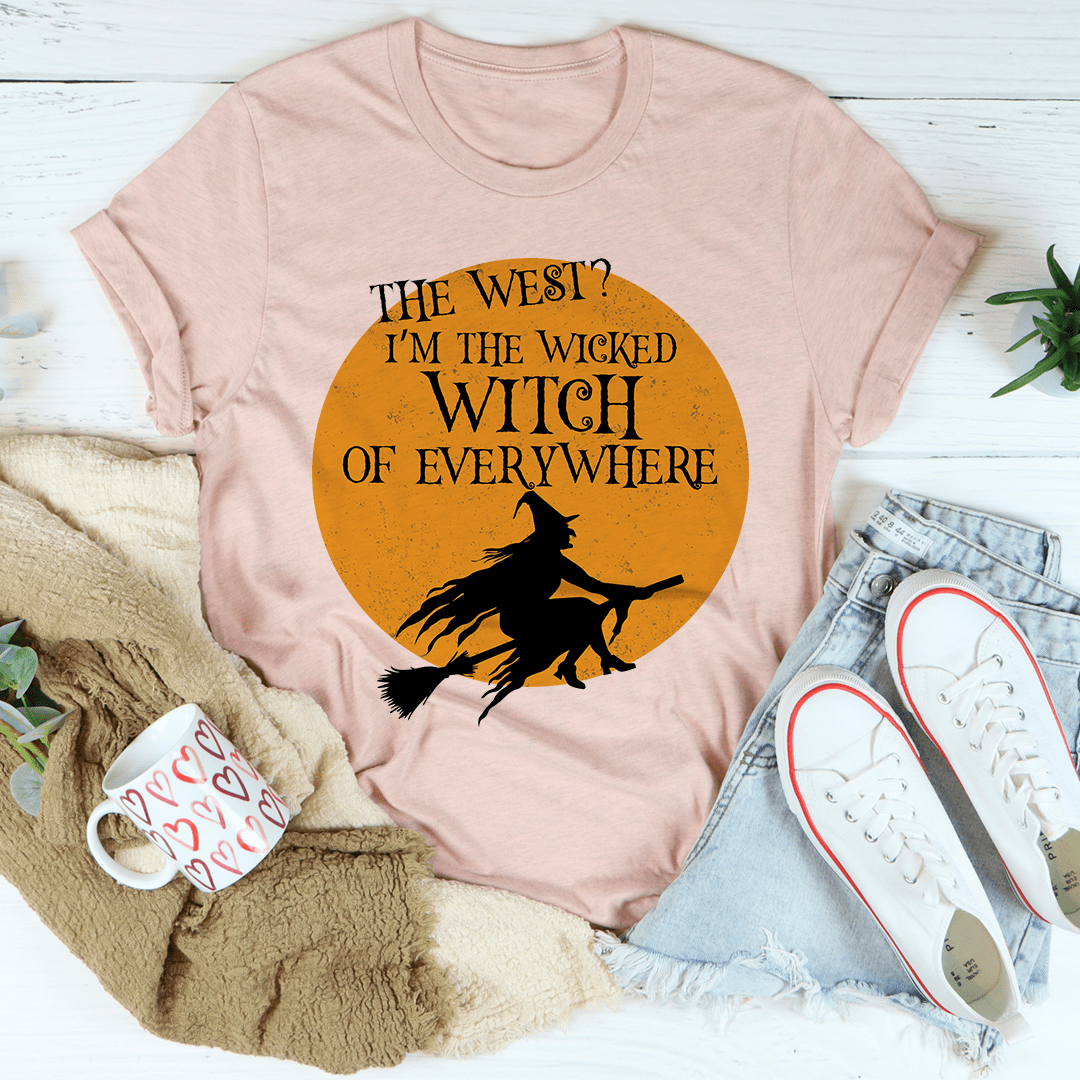 A black Halloween tee featuring a whimsical witch design, made from 100% soft cotton, perfect for festive celebrations.