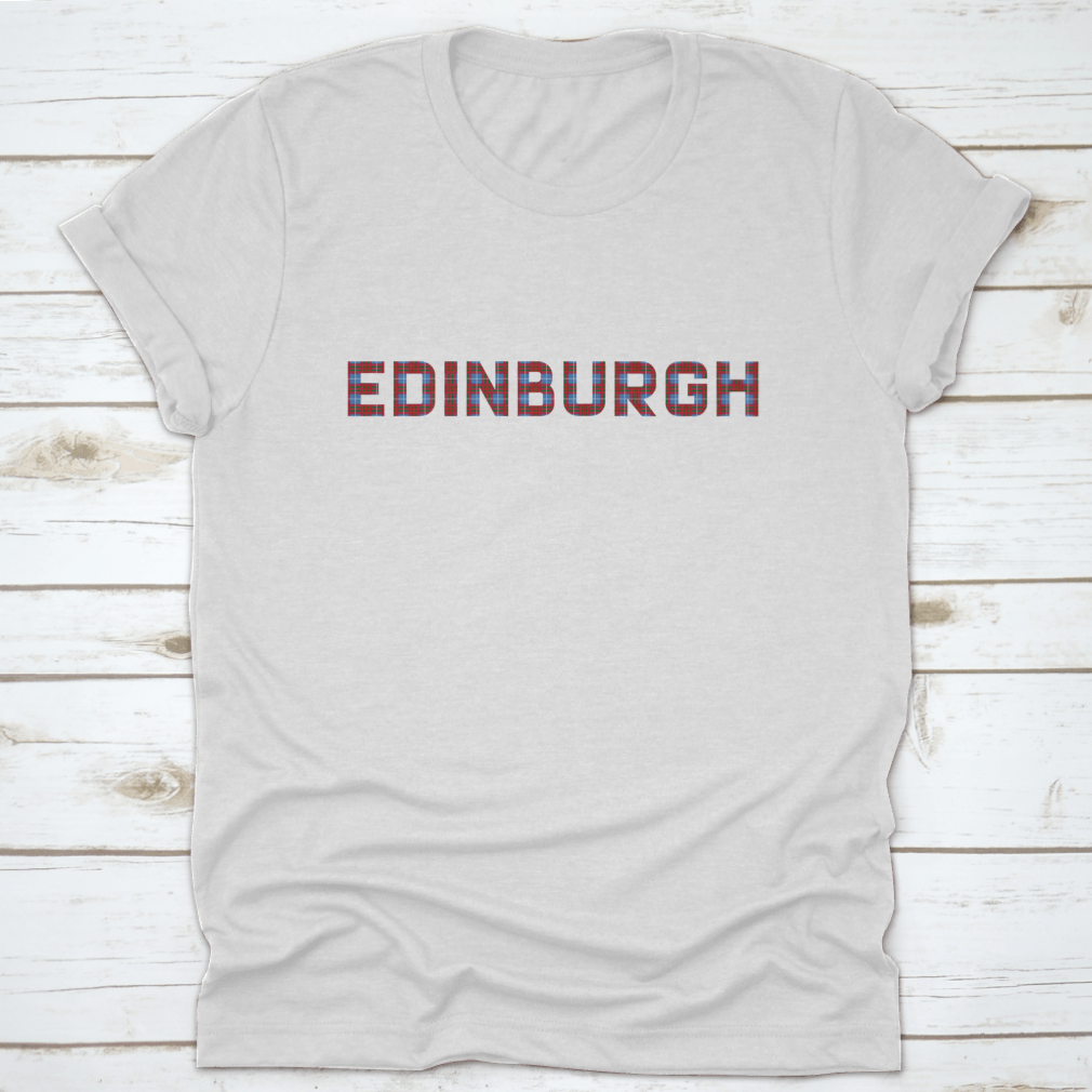 A stylish shirt featuring the word 'Edinburgh' in letters inspired by the Edinburgh tartan, showcasing vibrant colors and a comfortable fit.