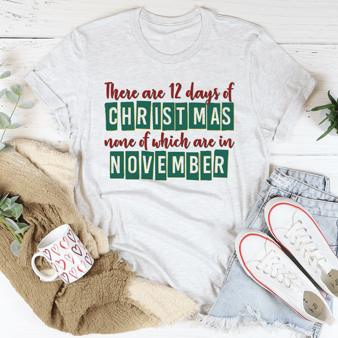 A festive 12 Days Until Christmas Tee made from 100% soft cotton, featuring a vibrant holiday-themed design.