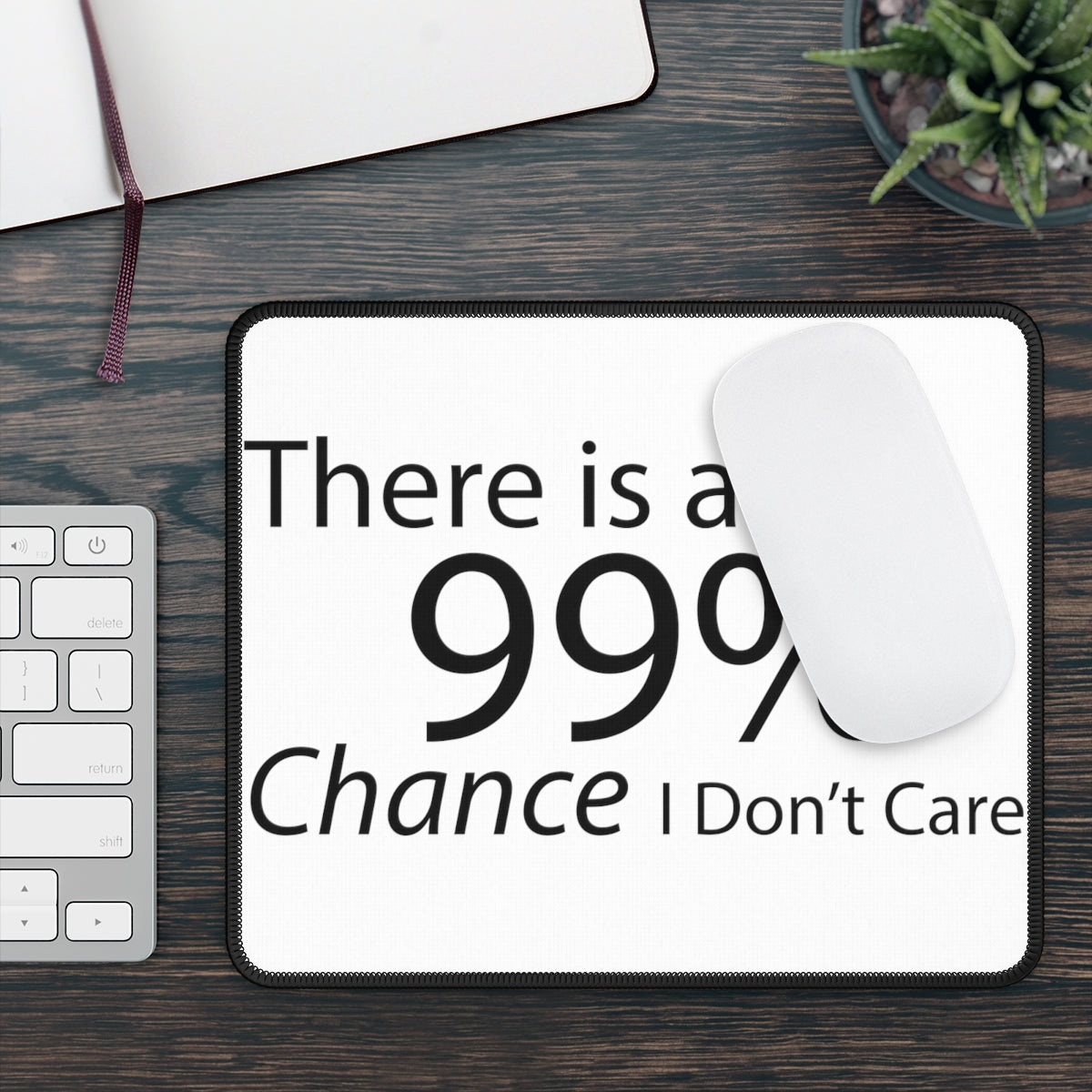 A vibrant gaming mouse pad featuring the phrase 'There is a 99% Chance I Don't Care', designed for smooth mouse movements and durability.