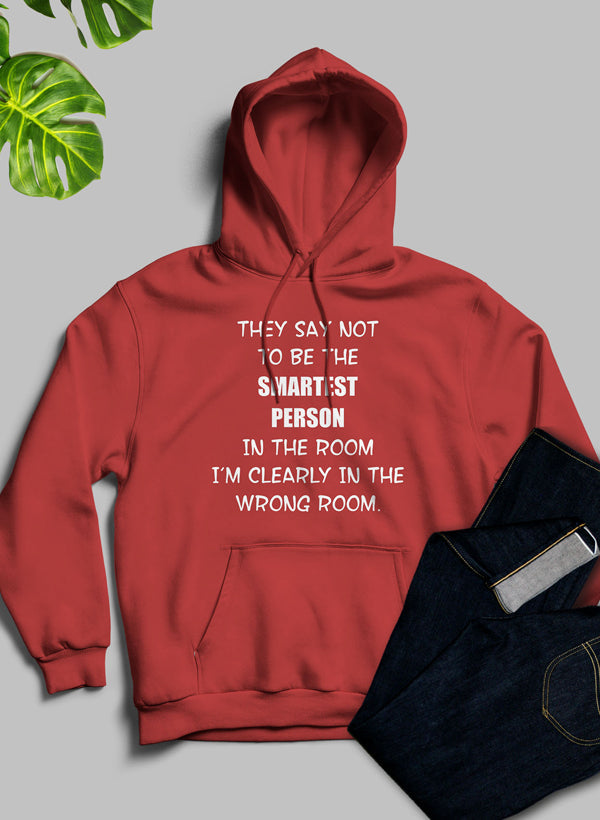 A stylish hoodie featuring the phrase 'They Say Not To Be The Smartest Person In The Room', designed by top artists, showcasing a cozy fleece blend.