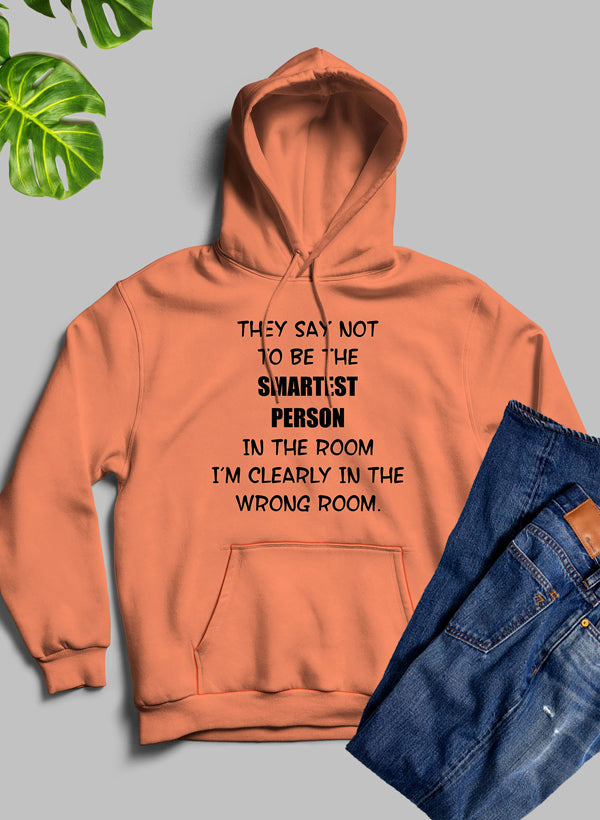 A stylish hoodie featuring the phrase 'They Say Not To Be The Smartest Person In The Room', designed by top artists, showcasing a cozy fleece blend.