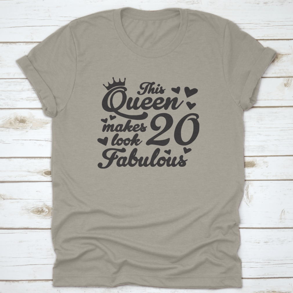 A stylish cotton t-shirt featuring the quote 'This Queen Makes 20 Look Fabulous', perfect for celebrating a 20th birthday.