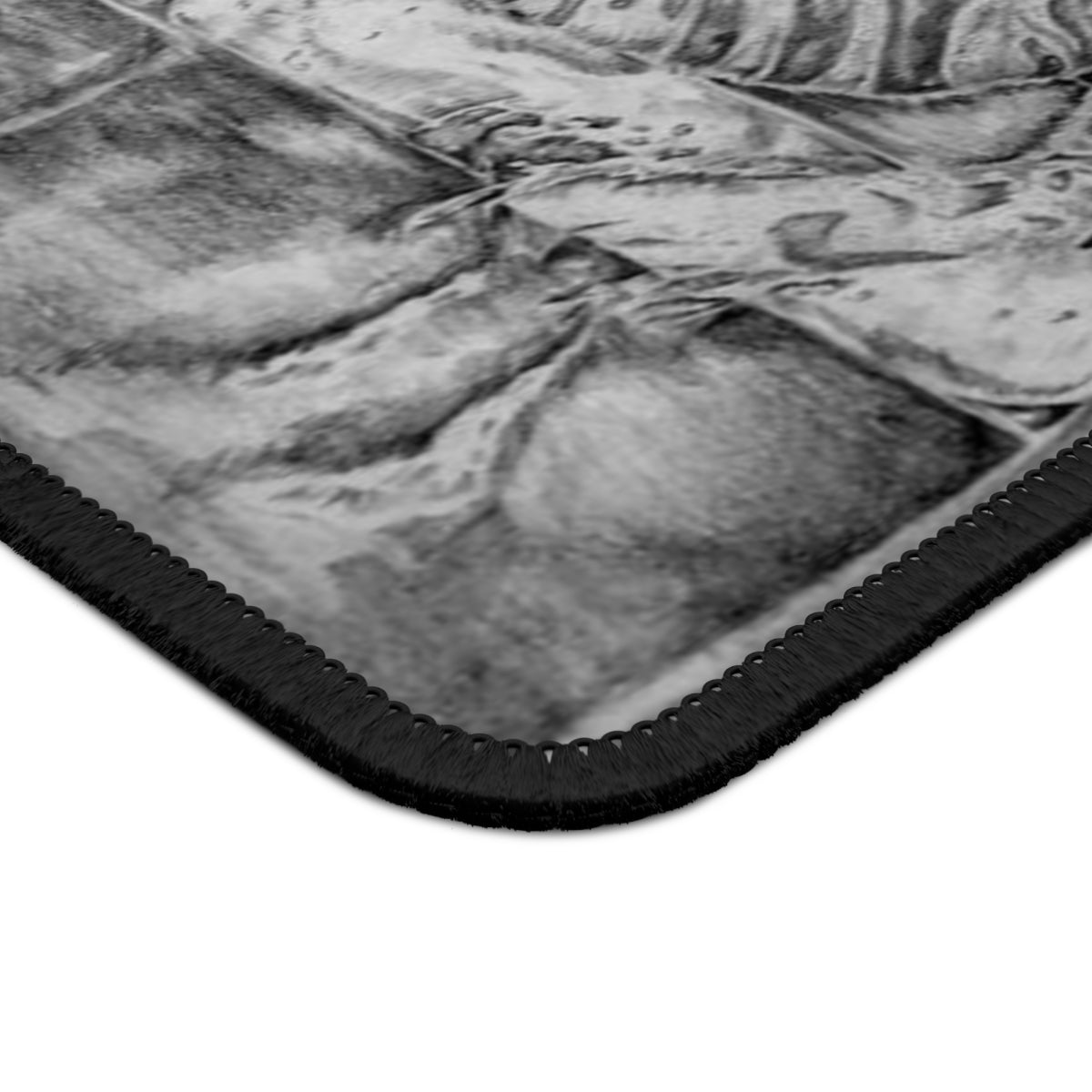 A vibrant gaming mouse pad featuring a tiger lounging on a couch, designed for smooth mouse movements and durability.