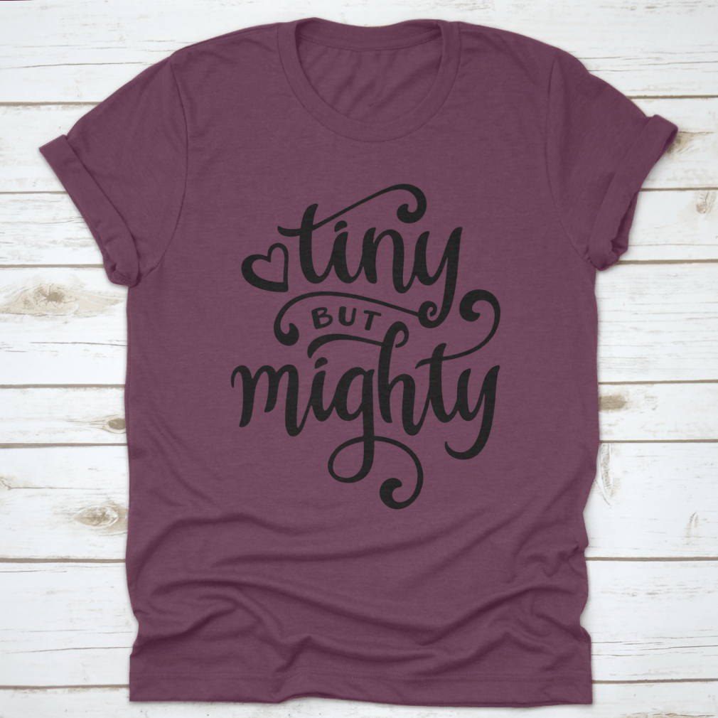 A stylish t-shirt featuring a hand-drawn calligraphy design, made from 100% cotton, showcasing its comfortable fit and artistic flair.