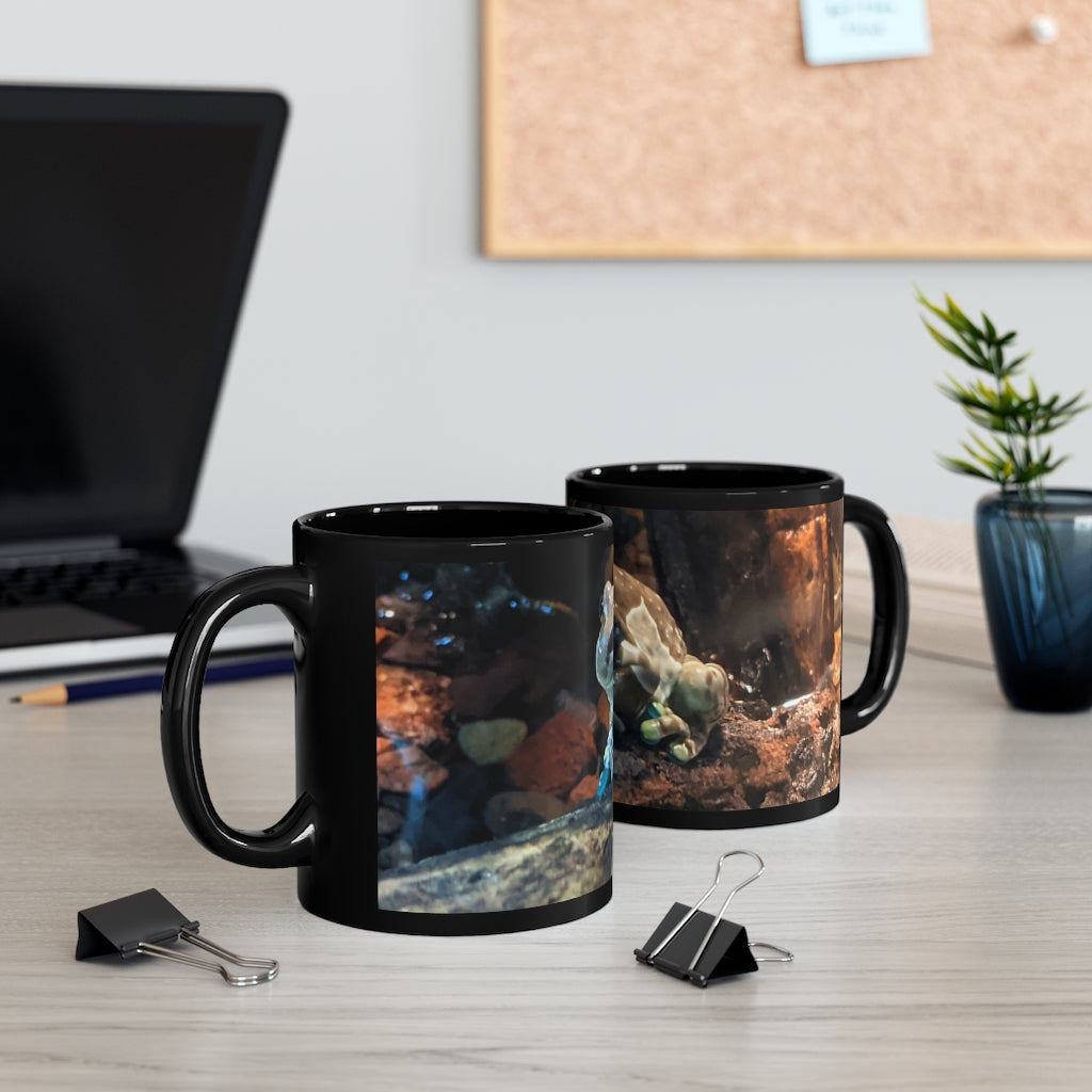 Toad 11oz black ceramic mug with a C-handle, perfect for coffee, tea, or hot chocolate, showcasing customizable designs.