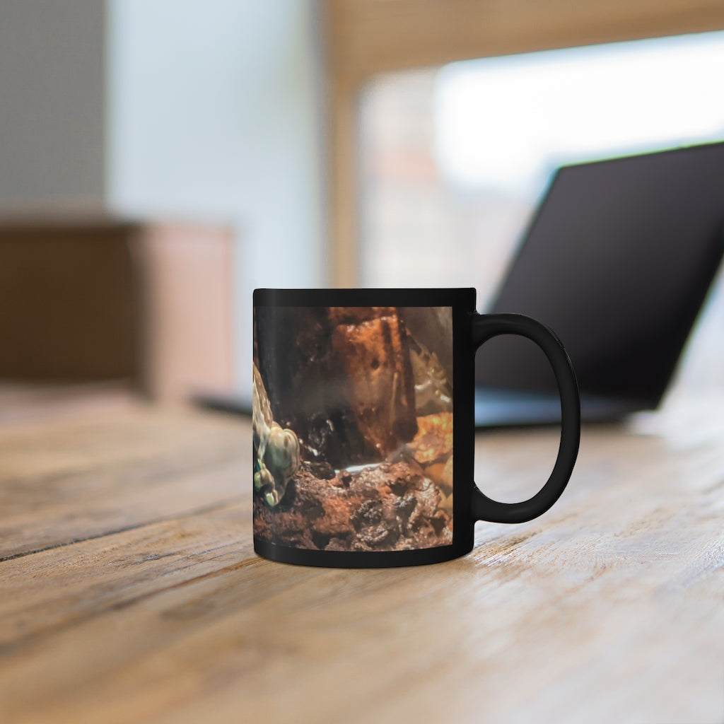 Toad 11oz black ceramic mug with a C-handle, perfect for coffee, tea, or hot chocolate, showcasing customizable designs.