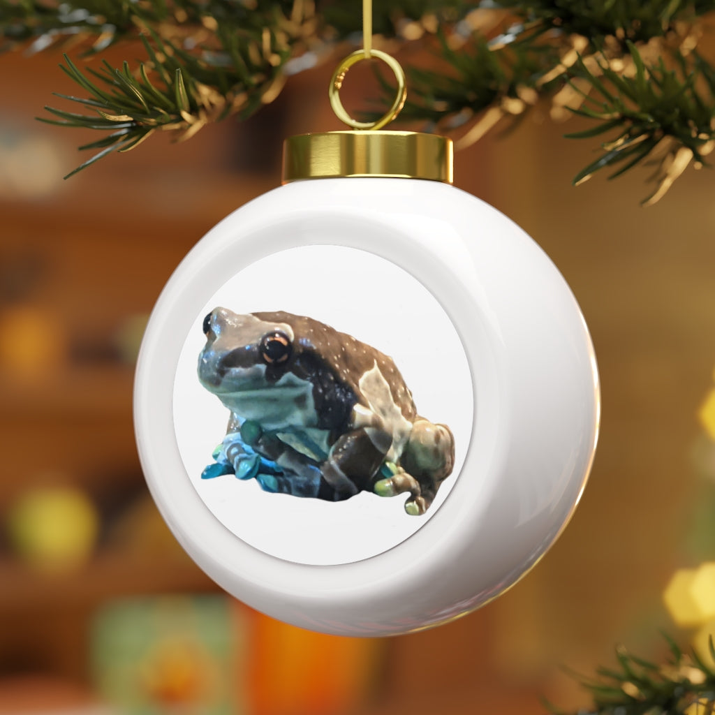 A beautifully designed Toad Christmas Ball Ornament featuring a glossy finish and gold ribbon, perfect for holiday decorating.