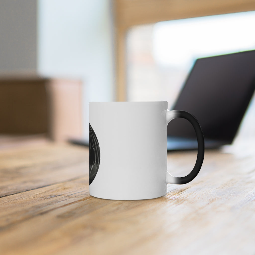 A white ceramic mug that changes color when filled with hot liquid, showcasing a fun and whimsical design.