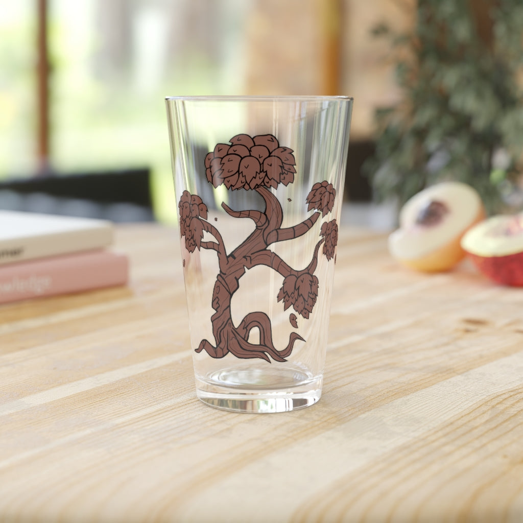 A clear 16oz Tree Pint Glass showcasing a customizable design, perfect for beverages and gifting.